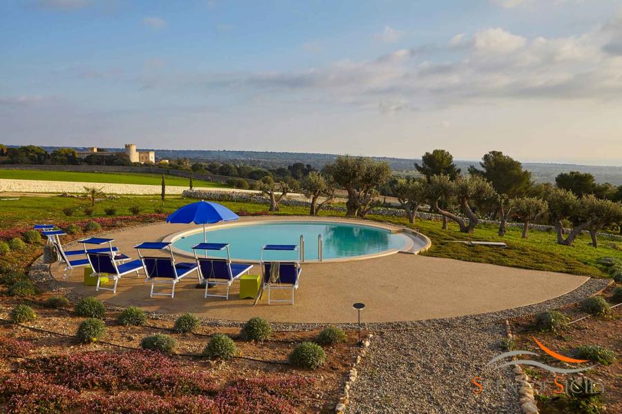 The castle of Donnafugata from the pool of Villa Bianca Levante Donnafugata Scent of Sicily