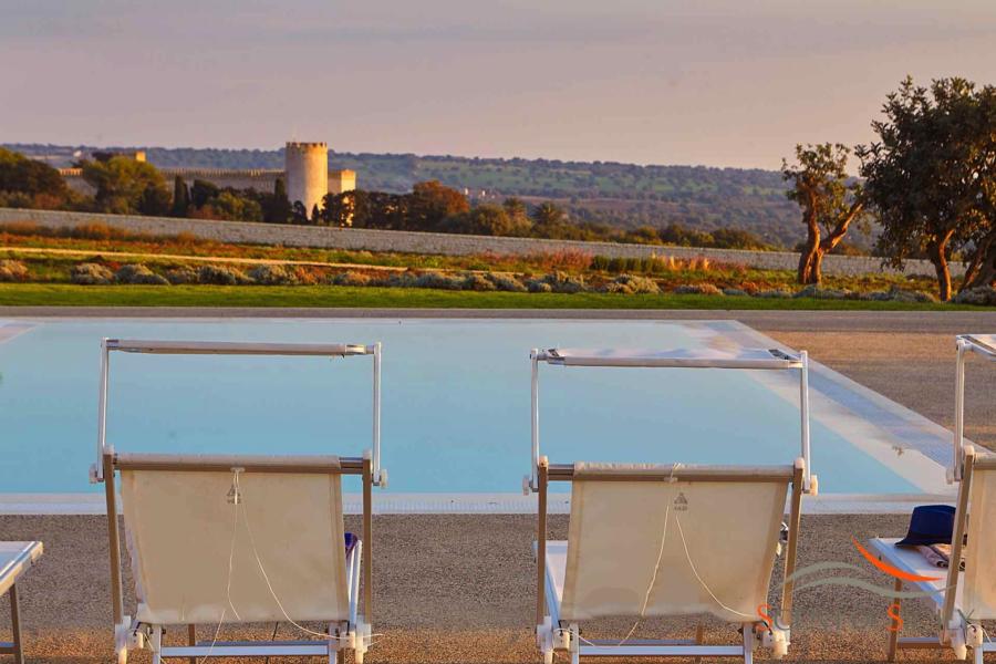 Villa Bianca, Donnafugata, Sicily - View of the castel form the rectangular infinity pool