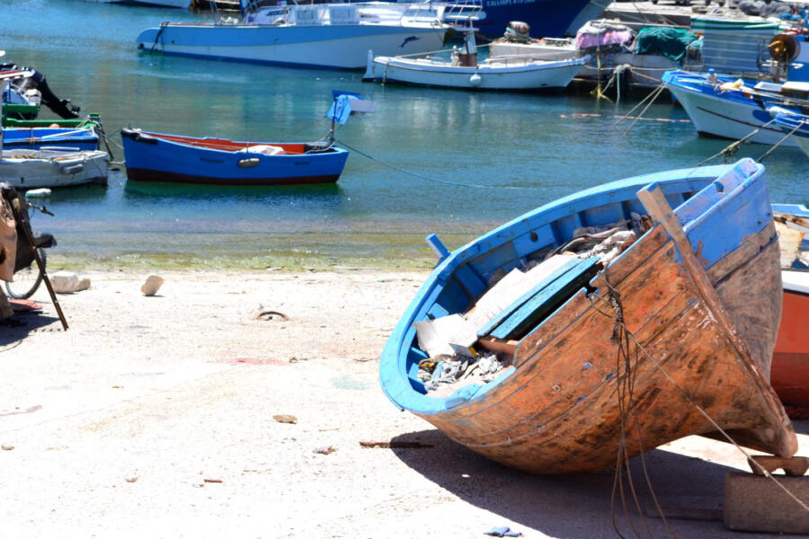Boat on the shore of a harbour