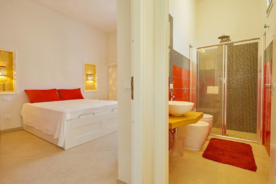 Red double bedroom en-suite in Villa del Tufo Marsala Scent of Sicily