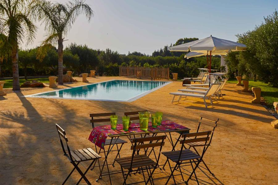 Dining near the pool in Villa del Tufo Marsala Scent of Sicily