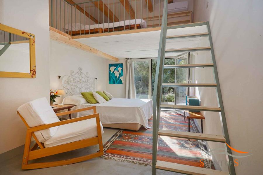 A staircase will take you to the loft where you will find a double bed in Villa Marina Scent of Sicily