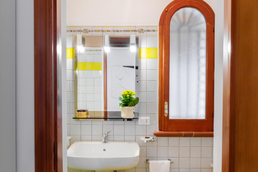 Yellow bathroom in Villa Amphora Carini Scent of Sicily