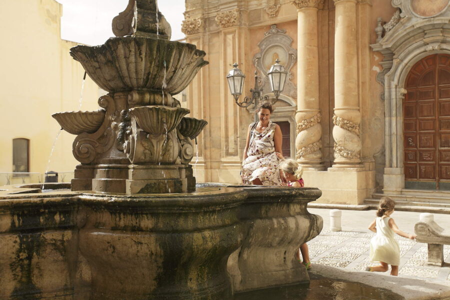 A sweet smile from a family in front of the church of Purgatory in Marsala