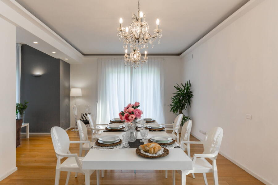The refined white elements of the dining room.