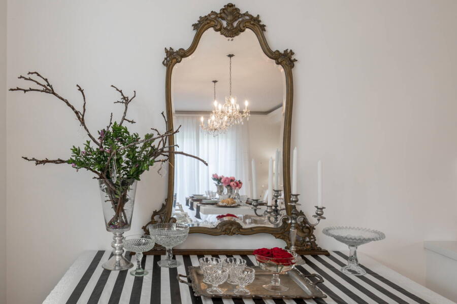 The dining room reflected in the ancient mirror.