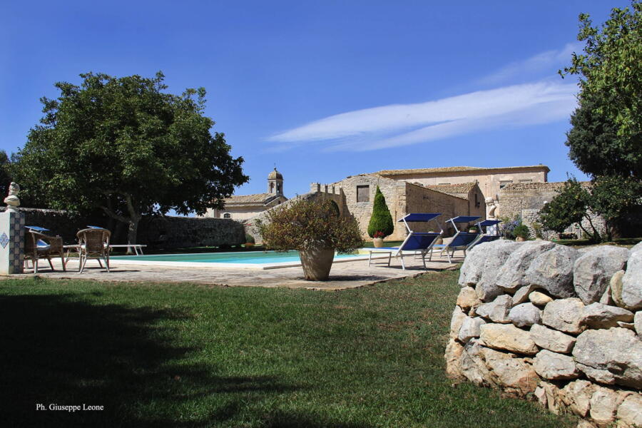 View from the green of the pool in this charming historic residence.