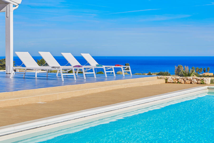 Relaxing by the pool surrounded by shades of blue