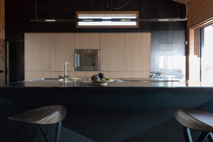 Eating on designer stools at the kitchen island counter