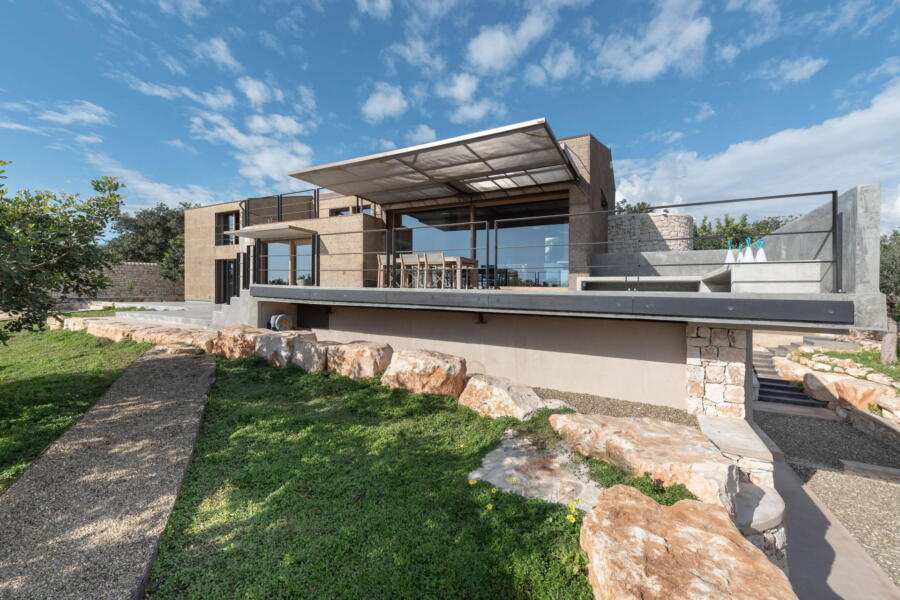 The architectural lines of the villa blend harmoniously with its surroundings