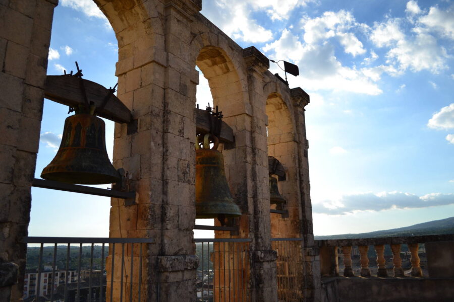 The notes of bells among the blue sky