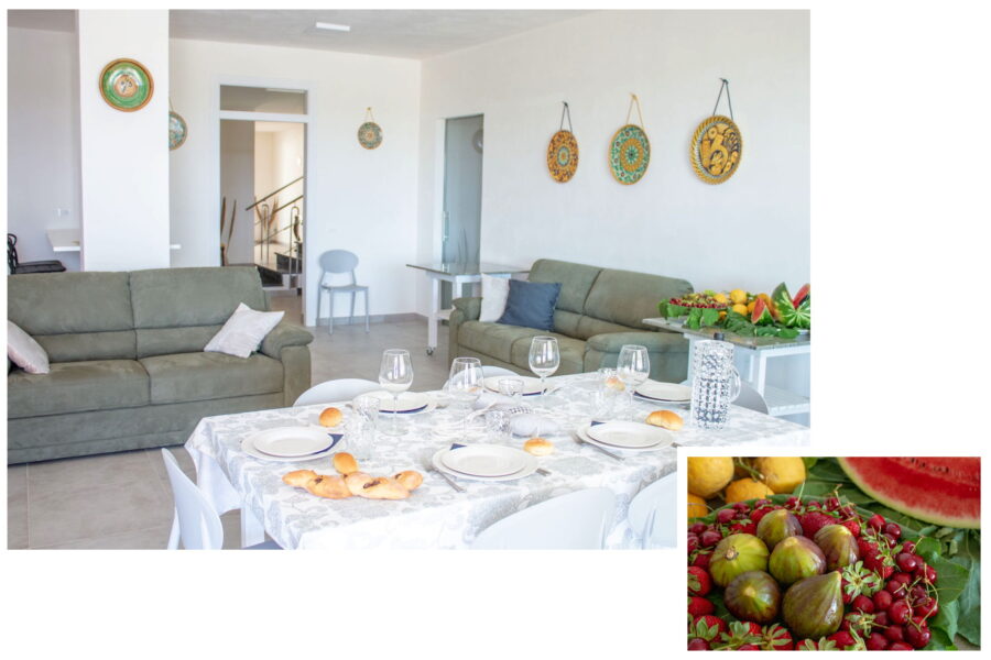 The delightful living room on the ground floor with the kitchen dining area and the useful console table 
