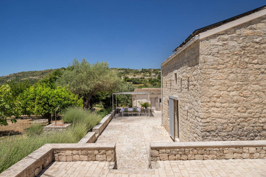 Sicilian Baroque villa's courtyard with pool.