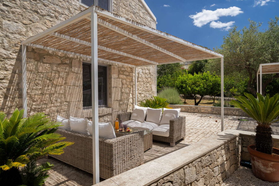 Cozy relaxation corner under a pergola in a Sicilian Baroque villa