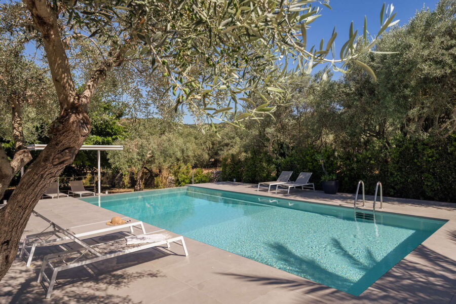 Villa's pool solarium surrounded by nature's colors in Baroque Sicily.