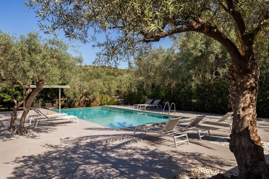 Villa poolside amidst nature's colors in Baroque Sicily.