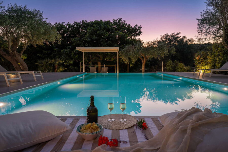 Villa pool in Sicilian Baroque surrounded by magical evening colors