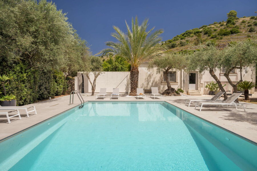 Relaxing by the pool at a villa in Sicilian Baroque