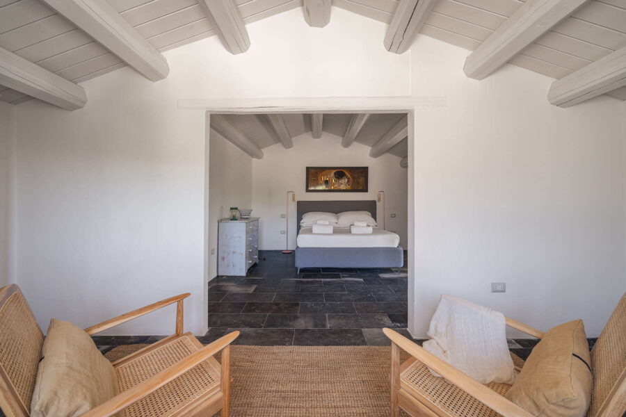 The master double bedroom at Casale Limestone, a villa in Sicily, showcasing the splendor of Sicilian Baroque