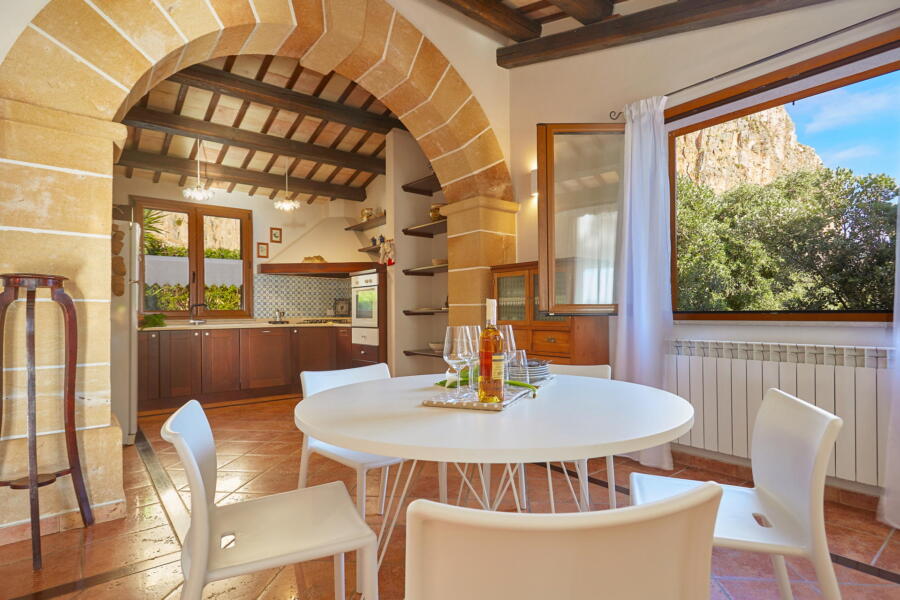 Traditional Sicilian kitchen with modern amenities at Villa Nature's Embrace.