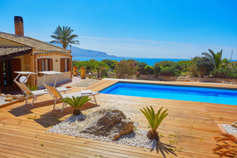 Tranquil poolside with Mediterranean views at Villa Nature's Embrace.