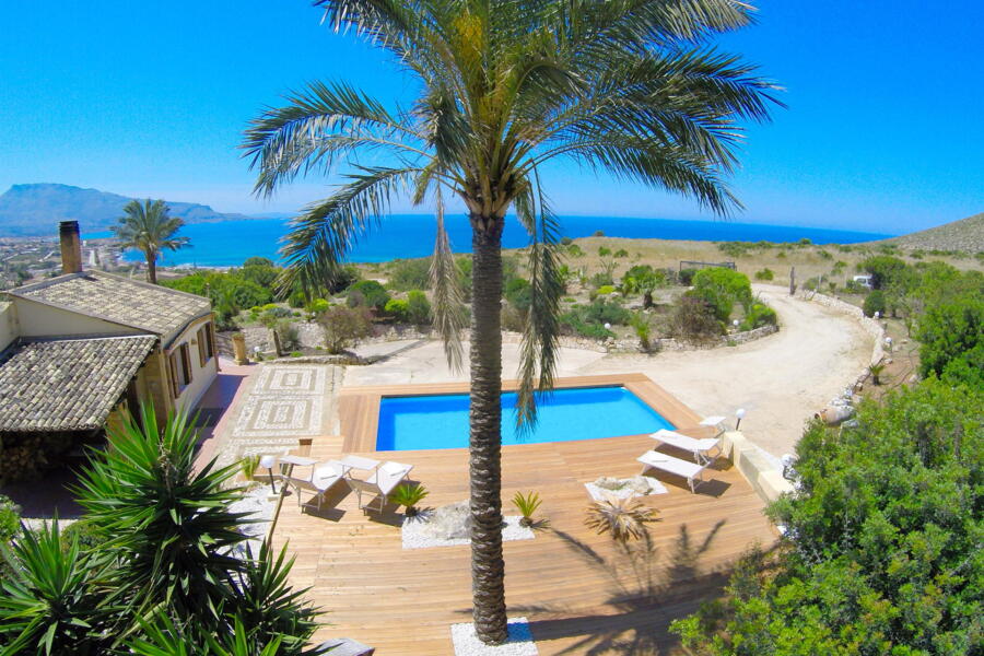 Aerial shot of Villa Nature's Embrace with pool and panoramic views.