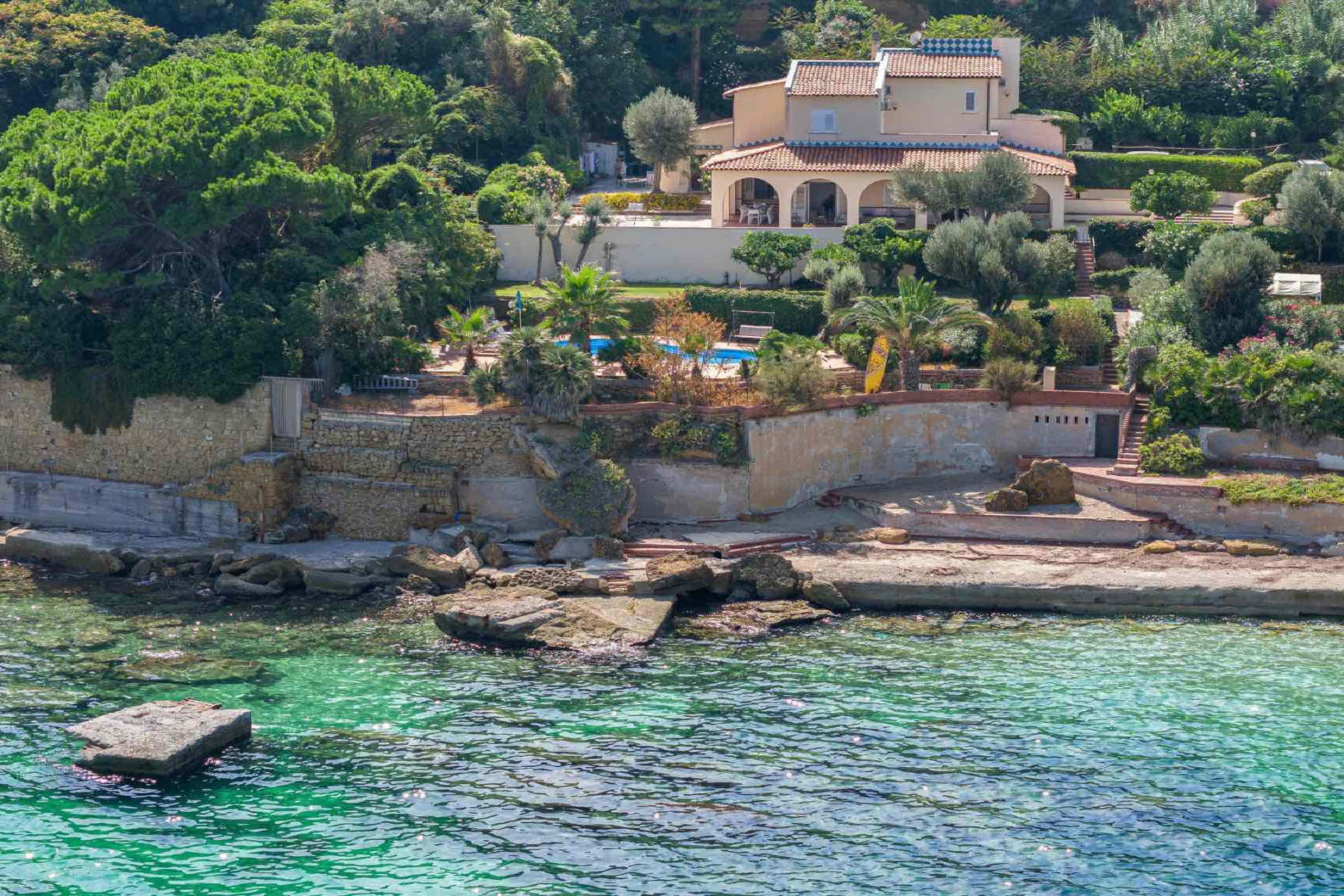 Sicily villa with pool, Villa Angela Blu, set amidst rich greenery, overlooking the azure Mediterranean Sea.