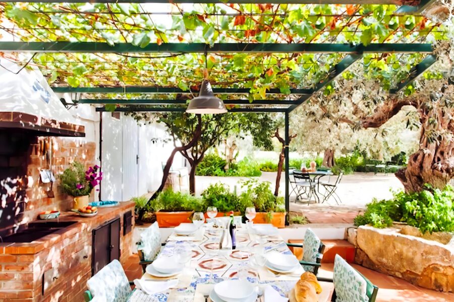 Al fresco dining on the patio next to the BBQ at a beautiful Sicily villa with a pool