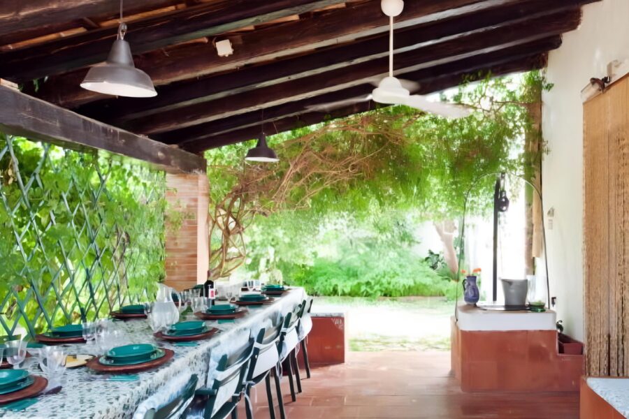 Inviting patio of a Sicilian villa with a pool, ideal for a relaxing lunch surrounded by Mediterranean charm