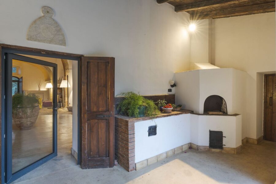 Traditional wood-fired oven at Villa Selvira, a Sicily luxury villa, blending rustic charm with modern comfort.