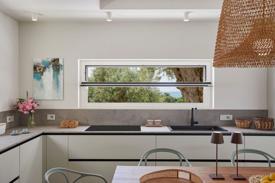 Sea Essence modern kitchen with panoramic window in Pozzallo – Sicily Luxury Villas with pool