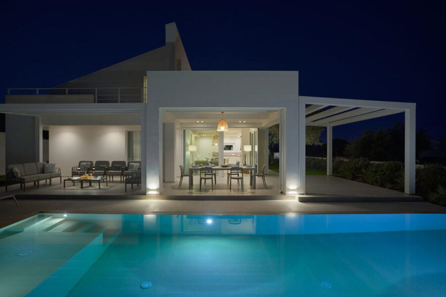 Sea Essence modern villa exterior at night with illuminated private pool in Pozzallo – Sicily Luxury Villas with pool