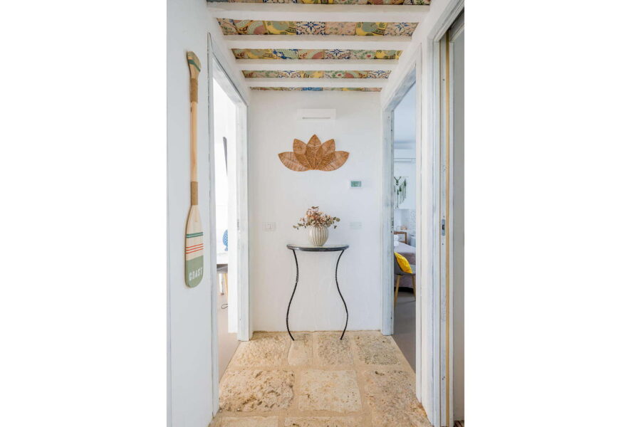 Elegant hallway at Villa Brezza Marina in Scopello with stone flooring, decorative tiled ceiling and handcrafted details – Sicily Luxury Villas and Sicily villas with pool