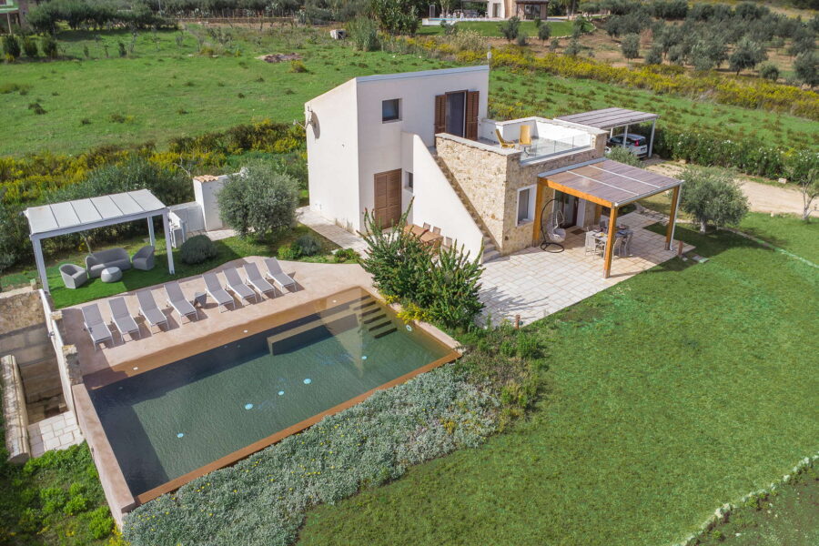 Aerial view of Villa Brezza Marina in Scopello with private pool, sun loungers, pergola and large green garden – Sicily Luxury Villas and Sicily villas with pool