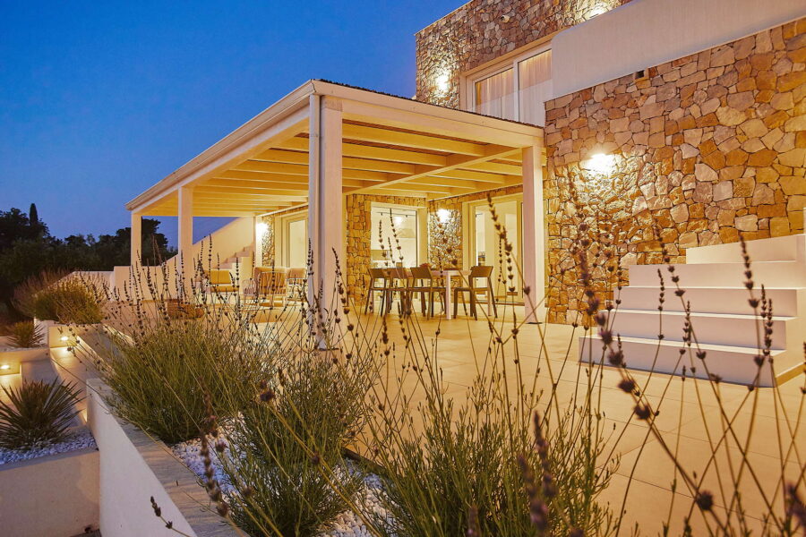 Sicily Luxury Villas with pool – modern stone villa terrace at sunset in Castellammare del Golfo, outdoor dining area and soft lighting, Villa White Horizon