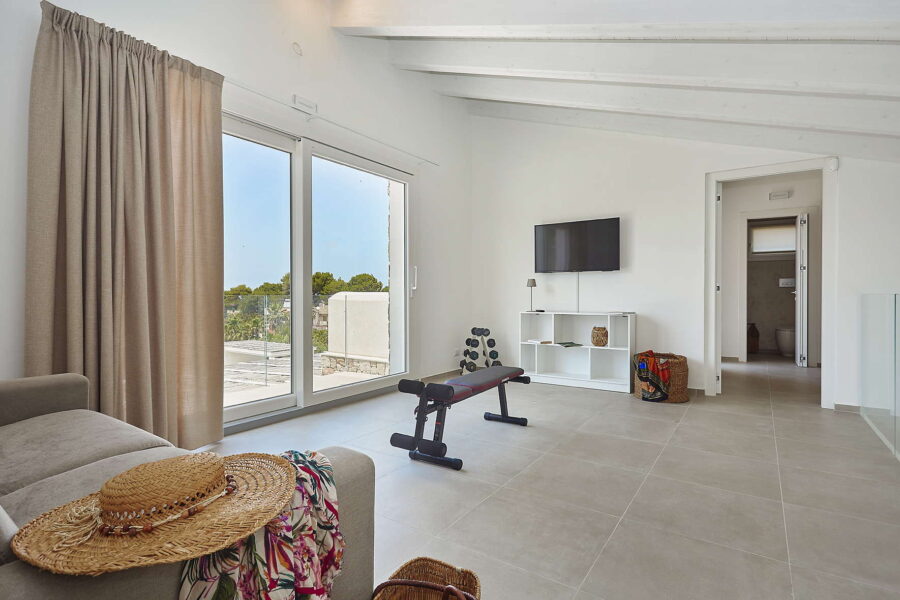 Upper floor living area with large windows, terrace view and lounge space in Sicily Luxury Villas – Villa White Horizon, Sicily villas with pool