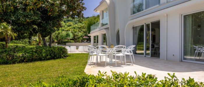 Villa Orlaya patio with outdoor dining area, garden views, and modern architecture in Sicily, Sicily villas with pool by Scent of Sicily