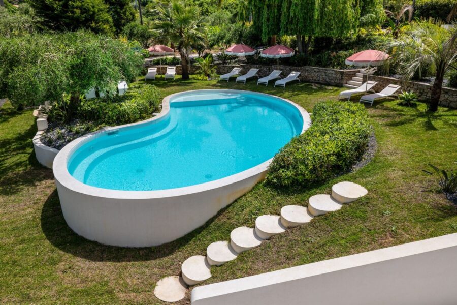 VillaOrlaya-Capo-di-Orlando-PoolSkyView-ScentOfSicily Aerial view of Villa Orlaya private swimming pool surrounded by tropical gardens and sun loungers in Sicily, Sicily villas with pool by Scent of Sicily
