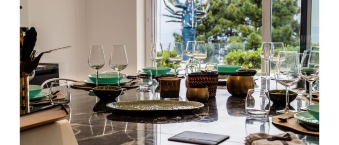 Stylish dining table with sea view at Villa Orlaya, a contemporary Sicily villa with pool featuring elegant interiors and panoramic coastal scenery.