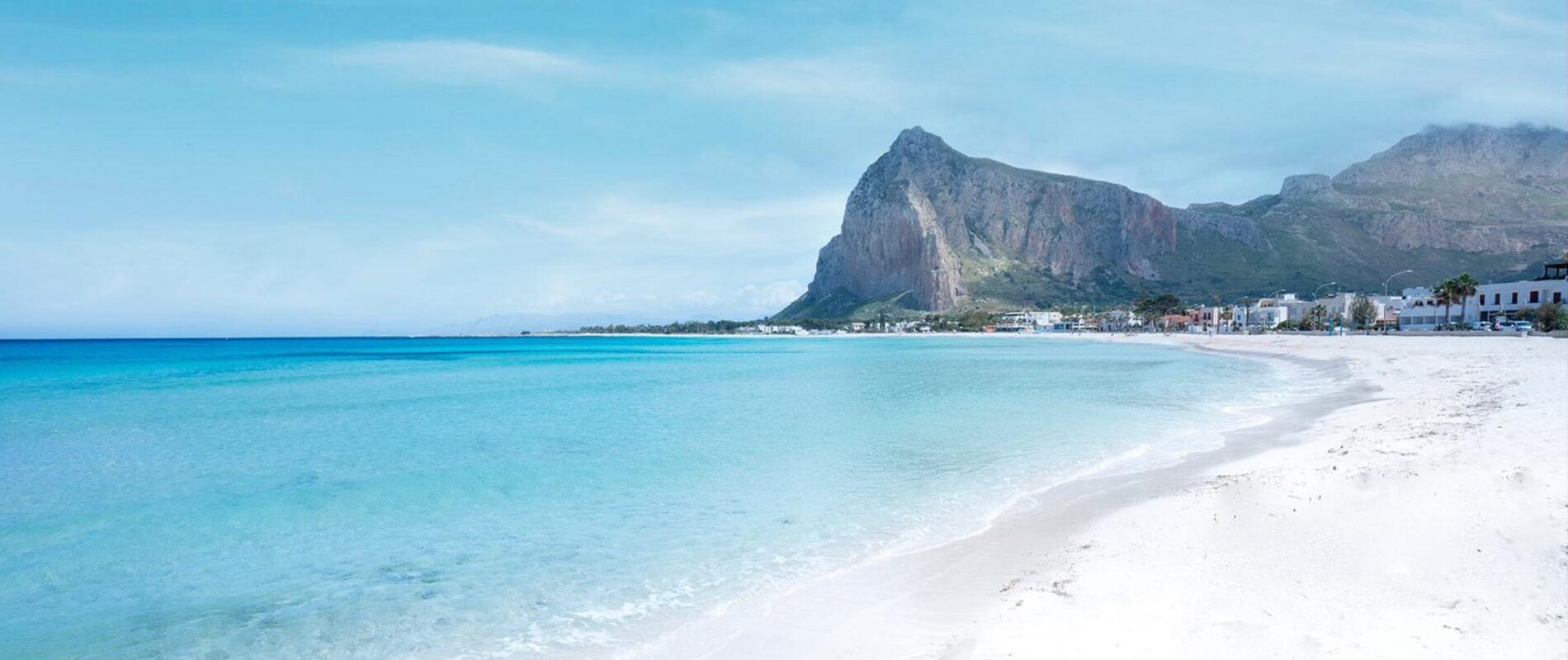 San Vito Lo Capo beach with turquoise water and Monte Monaco in the background
